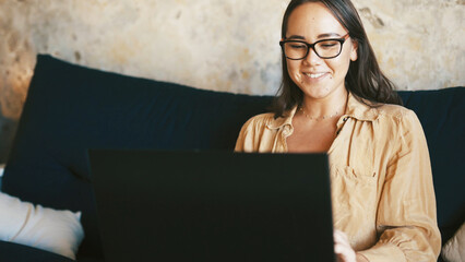 Student, laptop and smile with woman on sofa for college essay, online course and research thesis. University assignment, scholarship application and learning with person in living room of home