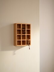 Wooden wall shelf with prayer beads hanging on it
