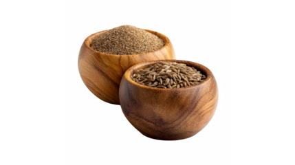 Wooden bowls filled with whole cumin seeds and ground cumin powder on a transparent background.