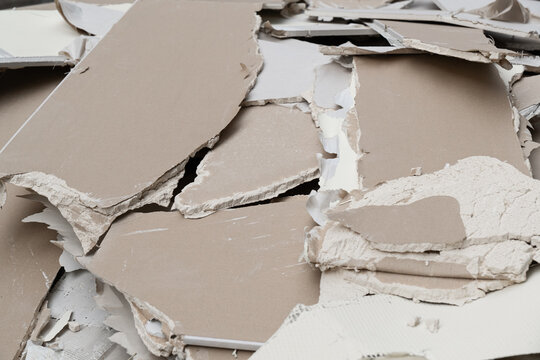 Heap of Broken Gypsum Boards and Drywall Scrap at Renovation Site