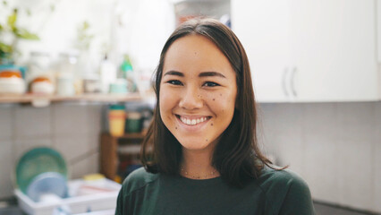 Chores, portrait and smile of woman in kitchen of home for cleaning responsibilities or routine....