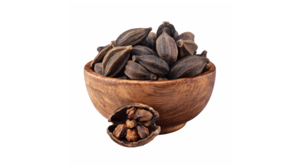 Aromatic black cardamom pods in a wooden bowl, a staple spice for rich culinary flavors