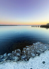 winter sunset at the frozen lake, silence winter mood