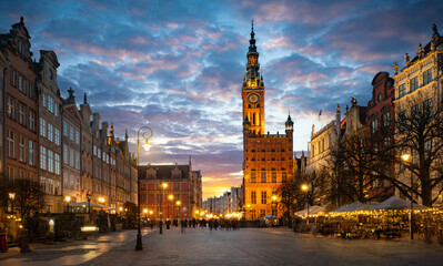 Street in an Old town and Town Hall in Gdansk, Poland. Panoramic evening view, long exposure, timelapse.  Historical city of Gdansk (Danzig) , Poland, Europe.