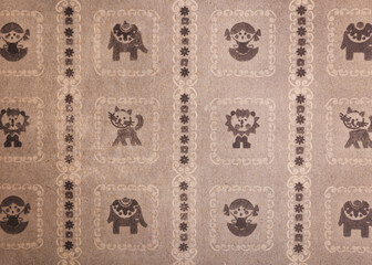 Old wallpaper on the wall. Old wallpaper for texture or background.