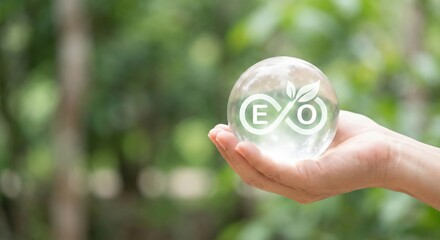 Adult Southeast Asian woman holding a glowing crystal ball with an eco infinity logo in a bright green forest during daytime, representing environmental sustainability and circular economy concept.
