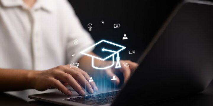 Online Education: A person working on the laptop in pursuit of knowledge and academic achievement, symbolizing the growing trend of remote learning and digital education