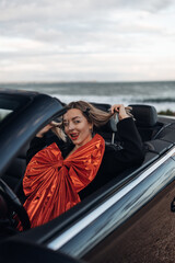 Happy Woman Receiving a Car as a Gift