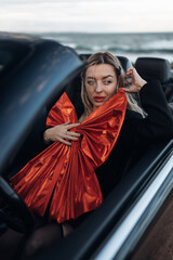 Happy Woman Receiving a Car as a Gift