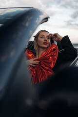 Happy Woman Receiving a Car as a Gift