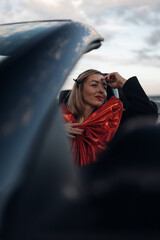 Happy Woman Receiving a Car as a Gift