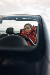 Happy Woman Receiving a Car as a Gift