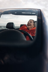Happy Woman Receiving a Car as a Gift