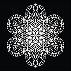 Intricate white floral mandala pattern on black background with symmetrical