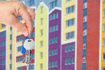 Hand holds the keys to a new apartment