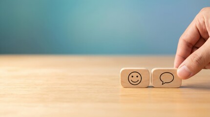 Hand placing feedback blocks with smiley icons, customer satisfaction