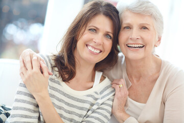 Portrait, senior mother or daughter with hug on couch, weekend visit or relax together for bonding....