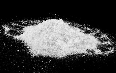 Large snow heap, snowdrift isolated on black background, snowy texture. White fluffy snow.