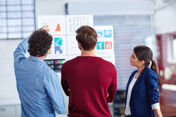 Project, teamwork and documents with business people in meeting for graphic designer, planning and research. Branding idea, paperwork and collaboration with employees in agency for design portfolio