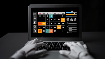 A sleek laptop showcases a vibrant calendar and various productivity tools, while robotic hands type efficiently on a dark workspace, emphasizing innovation in digital planning. Gantry