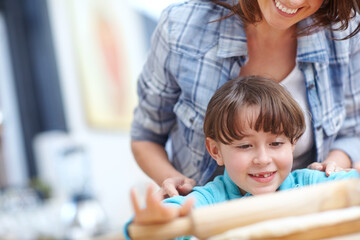 Baking, mother and child with rolling pin in kitchen for teaching recipe, culinary skills or help. Happy family, mom or girl with dough preparation in home for cookies, development and learning space