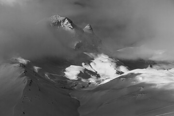 snow covered mountains, black and white photography of winter landscape.