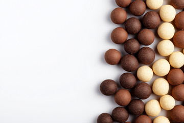 Chocolate and beige corn cereal balls on White or transparent background PNG, Copy Space
