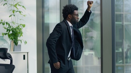 African American upset stressed business man in office thinking worried with bankruptcy bad work...