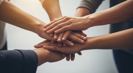 Close Up of Diverse Team Hands Stacked Together Symbolizing Unity and Professional Cooperation