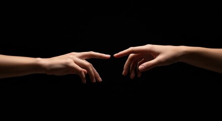 Close Up of Two Hands Reaching to Touch Fingers on a Solid Black Background