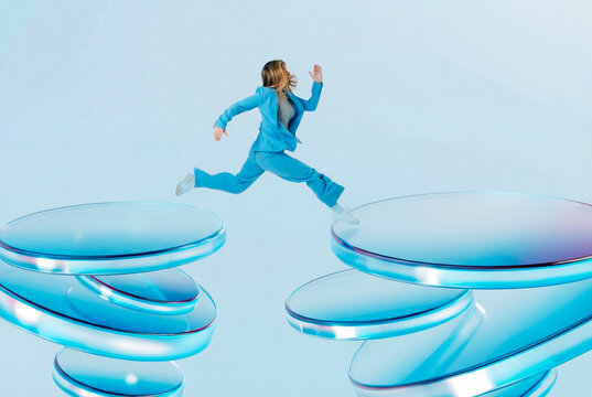 Woman leaping between 3D glass platforms