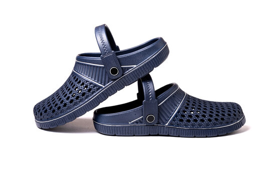 Unisex navy blue slip on clogs with rubber sole studio photography