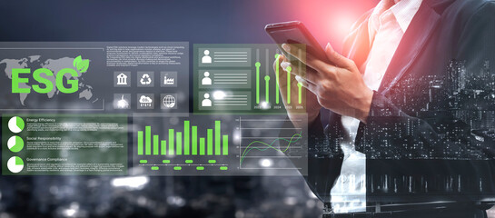 Business professional engages with ESG data on a smartphone, highlighted by vibrant graphs and a...