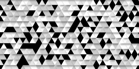 Abstract geometric pattern of triangles in grayscale creating a visual texture, a striking black and white optical illusion features a dynamic pattern of repeating triangles creating a sense of depth. © Abu Bokkor Siddique
