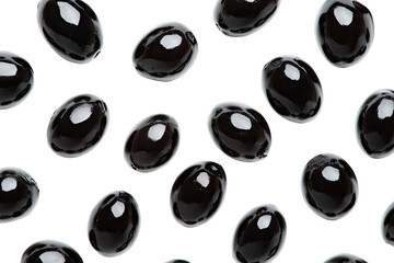 Glossy, dark oblong candies scattered on a black background