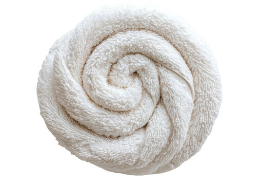 Rolled, fluffy white towel, spiral texture against black