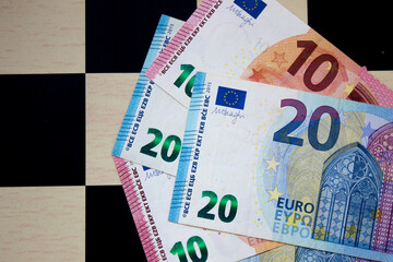 Twenty euros close-up on a chessboard background. National currency of the European Union