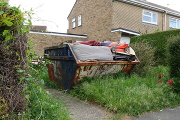 Rubbish Skip in a Garden