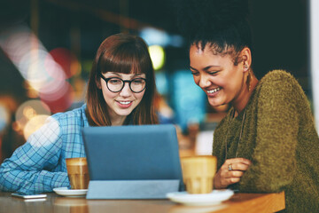 Fototapeta premium Collaboration, conversation and tablet with women in coffee shop at night for startup research. App, discussion and bokeh with entrepreneur friends in cafe for freelance business or remote work