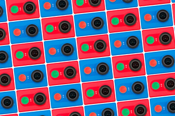 Bright pattern of red and blue action cameras arranged in diagonal rows on a white back
