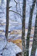 Flooding ice covered river in very cold winter day