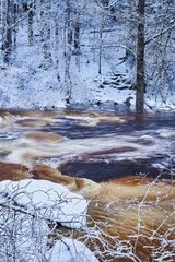 Flooding ice covered river in very cold winter day