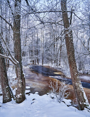 Flooding ice covered river in very cold winter day