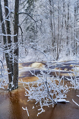 Flooding ice covered river in very cold winter day