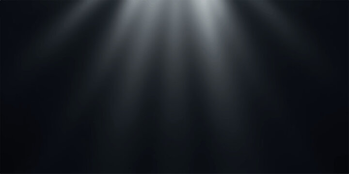Beam of light shining through darkness with rays of illumination