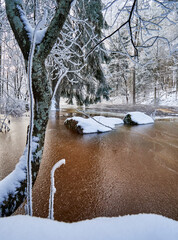 Flooding ice covered river in very cold winter day