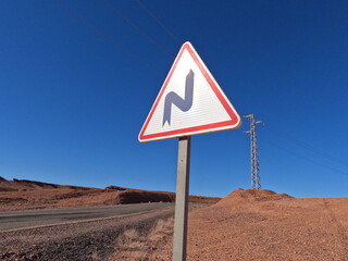 Double bend road sign