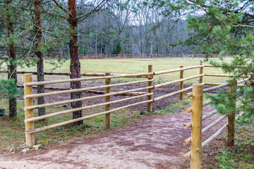 Rustic Wooden Fence Entrance to a Green Meadow