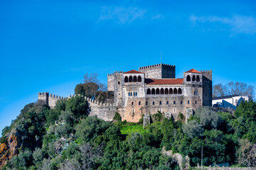 Leiria Castle on hill under blue sky Portugal