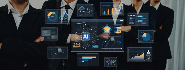 Business professionals engaging with advanced technology graphics showcasing artificial intelligence data in a contemporary corporate environment focused on innovation. Trope